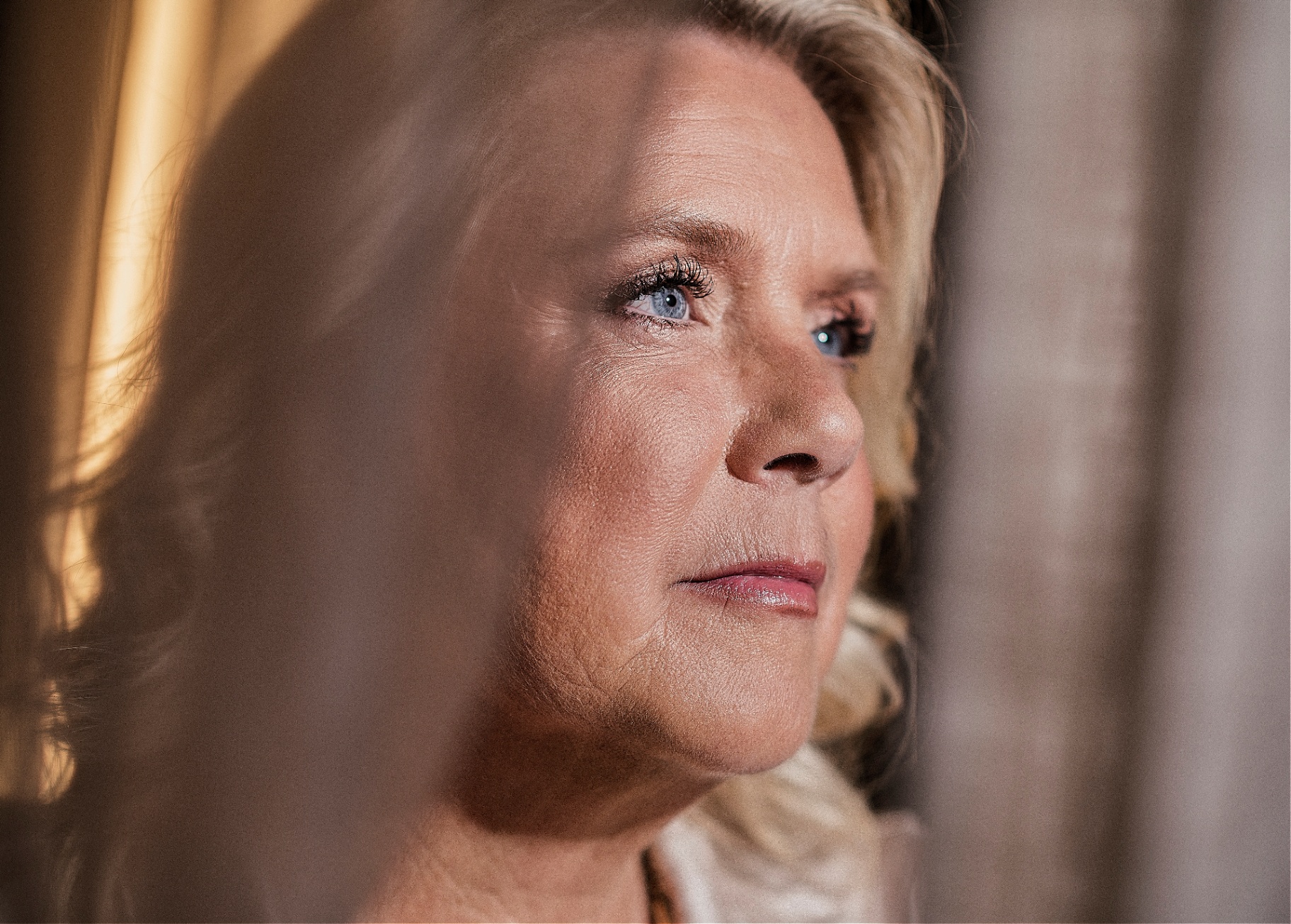 Camilla Ma Ra — side-lit profile, the woman stepping into leadership